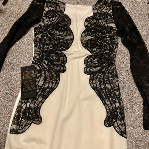 White with Black lace detail Bebe dress new with tags never worn